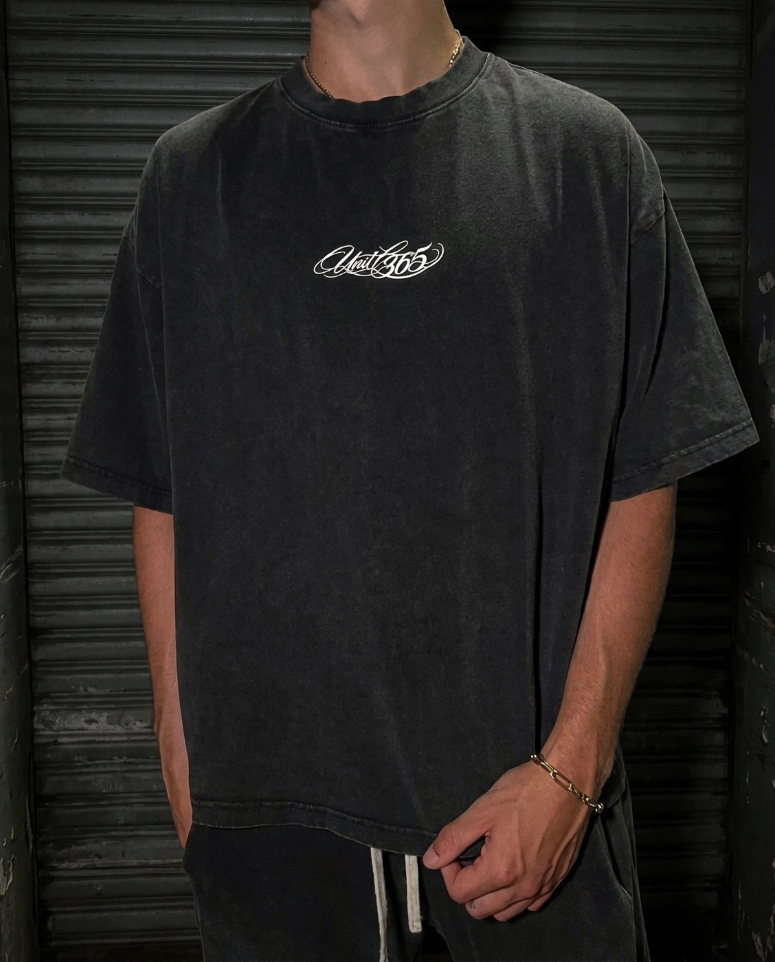 UNIT 365 black script tee front campaign shot