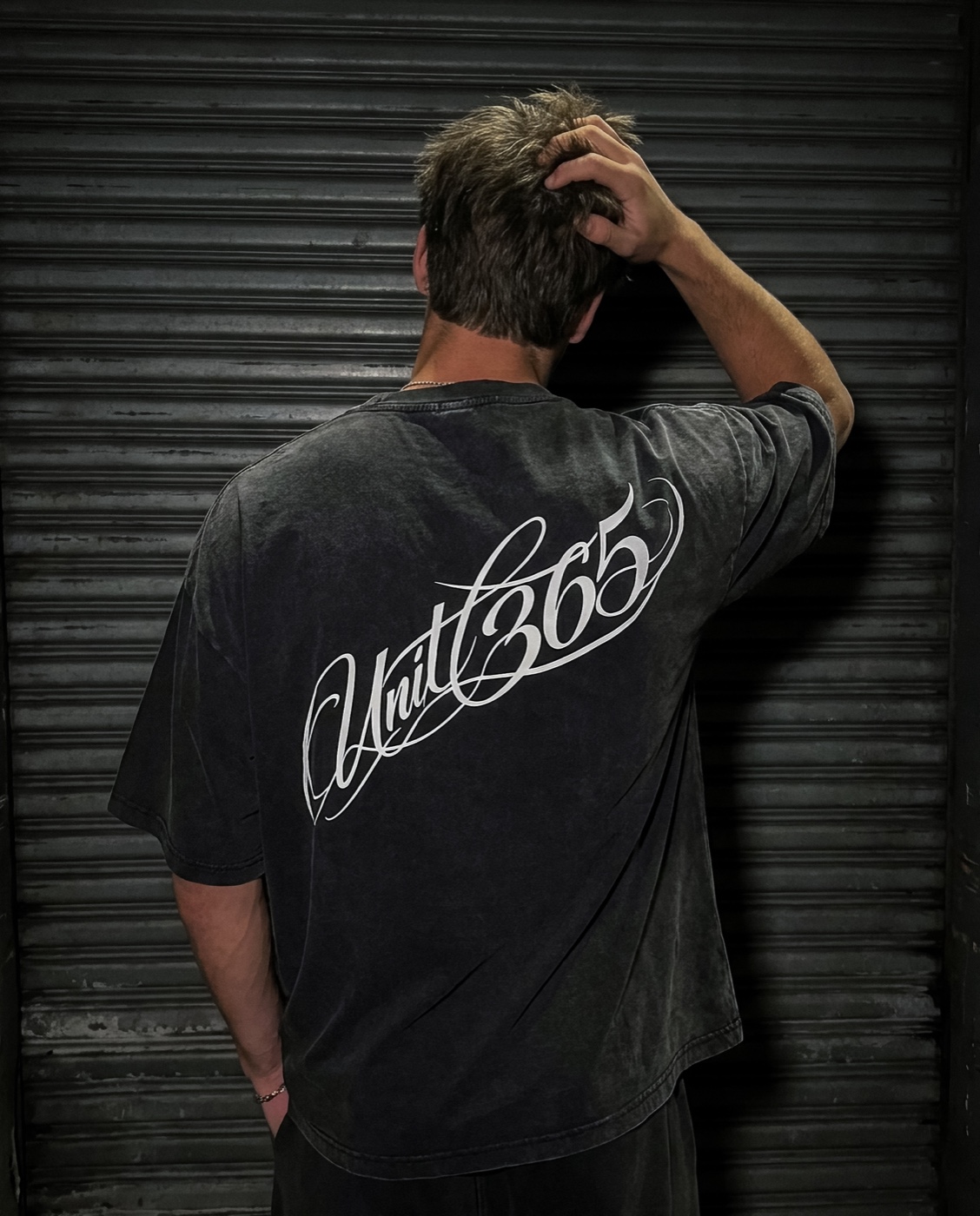 UNIT 365 black script tee back campaign shot
